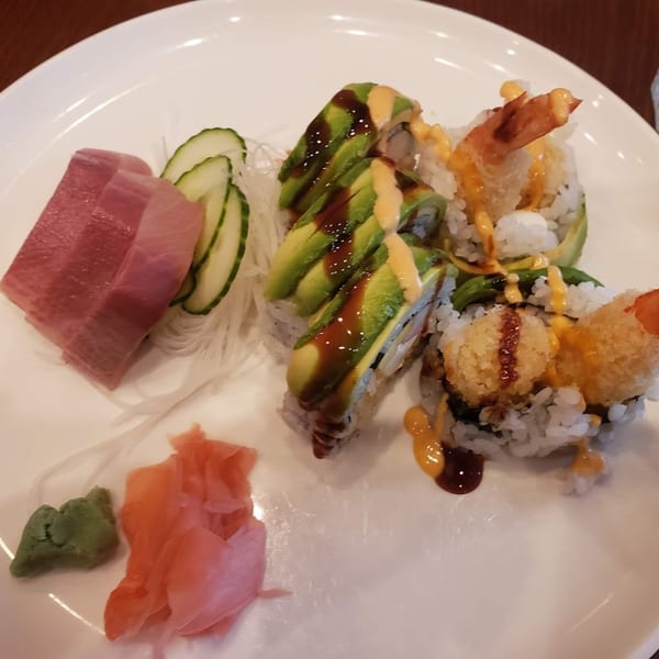 Sushi Joy's tuna sashimi, avocado rolls, and tempura shrimp rolls with ginger and wasabi.
